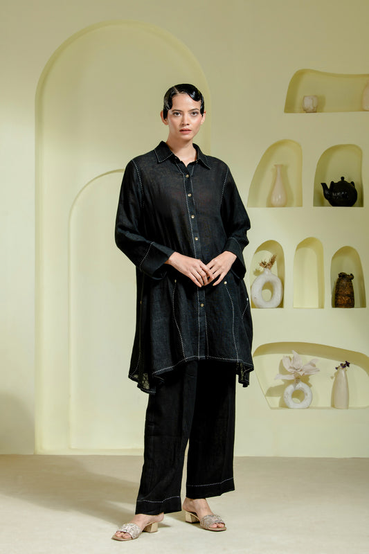 Relaxed silhouette is elevated with asymmetrical hand-done Kantha stitchwork
