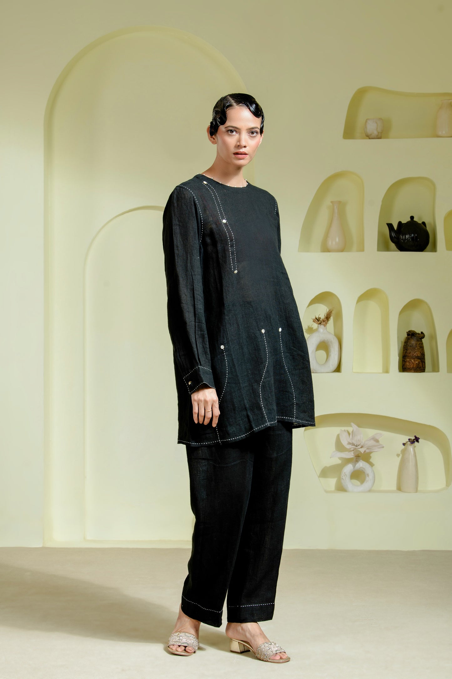 Relaxed silhouette is elevated with asymmetrical hand-done Kantha stitchwork