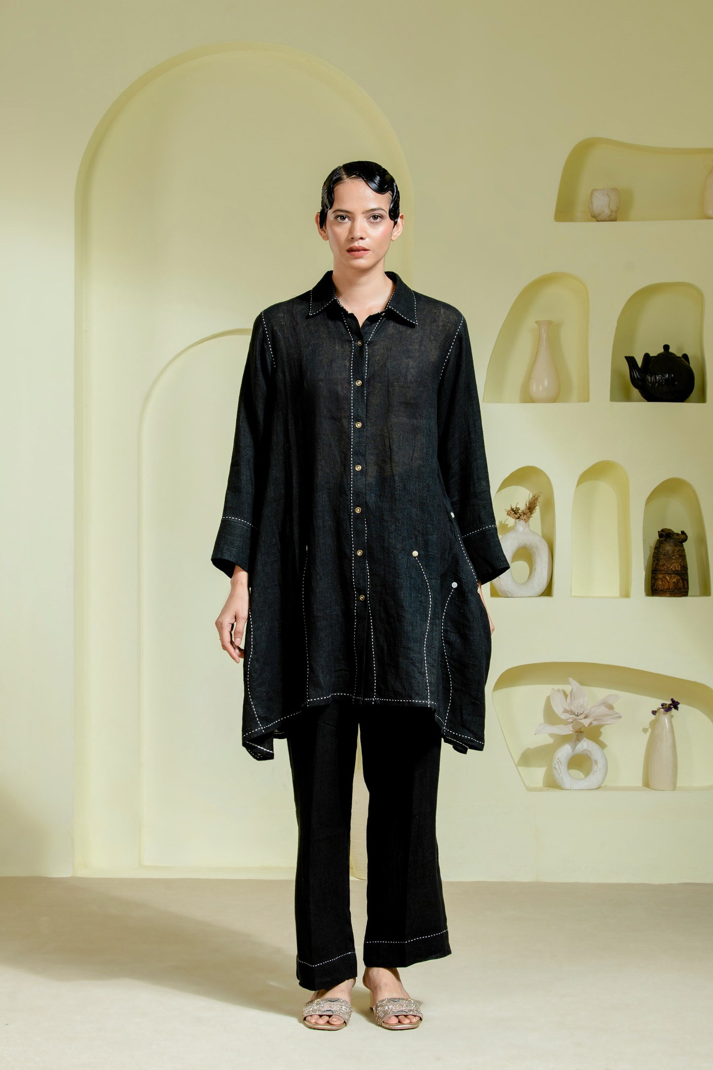 Relaxed silhouette is elevated with asymmetrical hand-done Kantha stitchwork