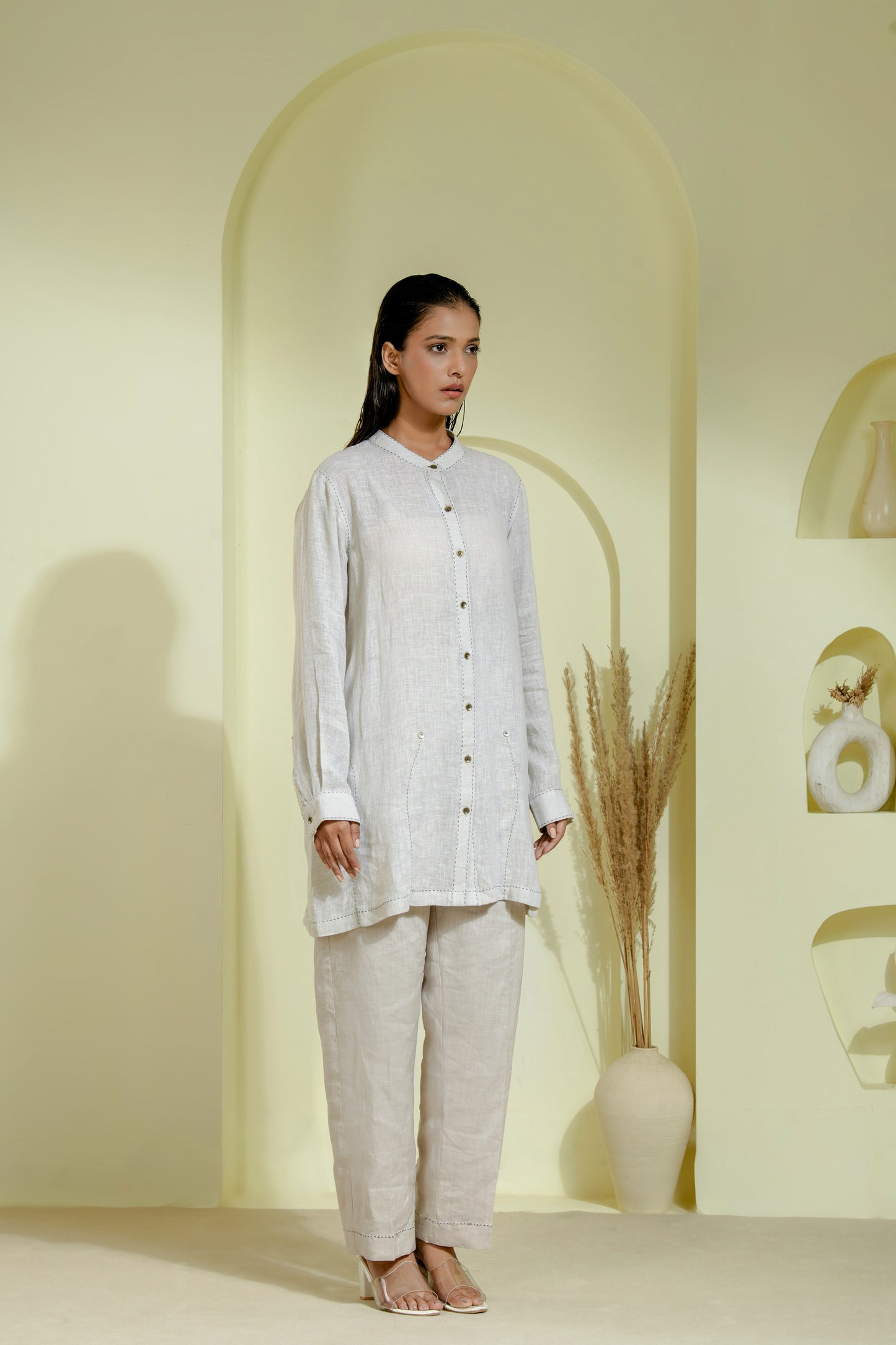 Elegant off-white A-line dress featuring a wrap-style bodice