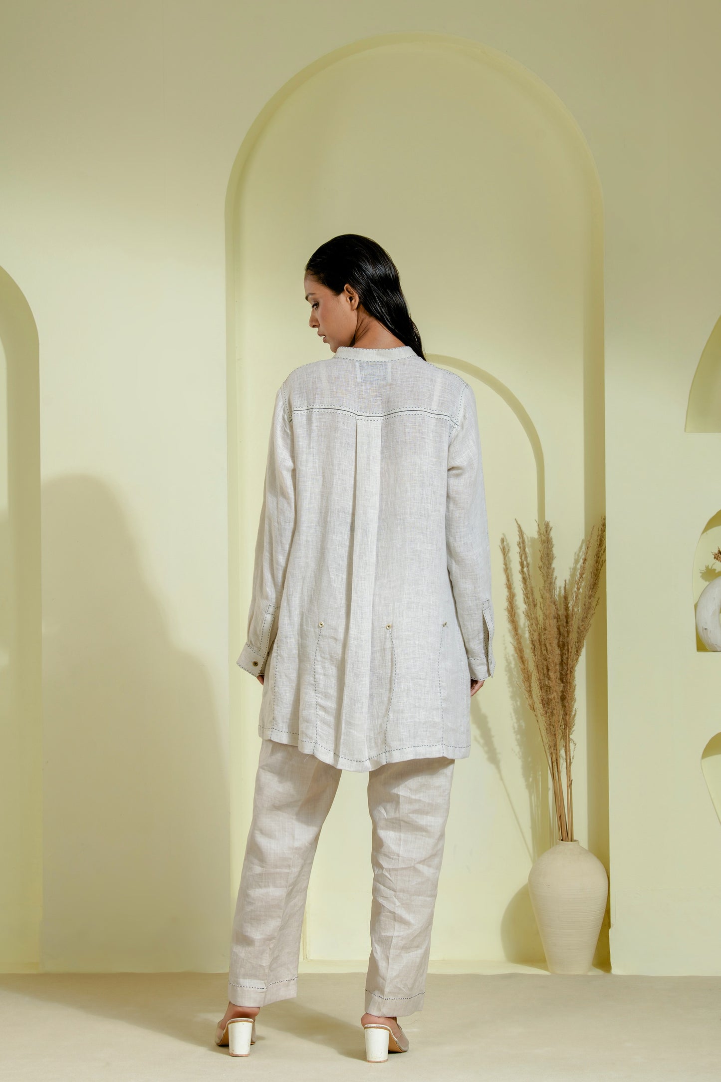 Elegant off-white A-line dress featuring a wrap-style bodice